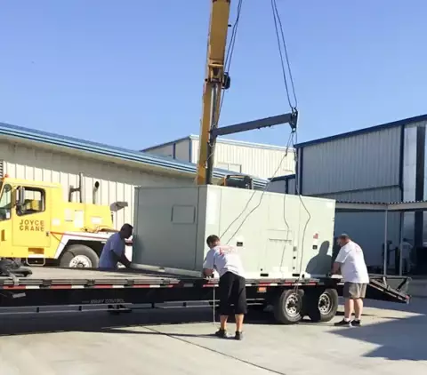Ready to lift a commercial HVAC unit with a crane to a rooftop